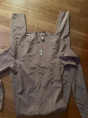 SKIMS sheer sculpt catsuit size large brand new with tags, discontinued